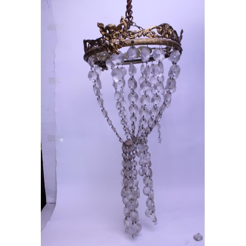 630 - A Brass mounted Bag Shaped Chandelier. Measuring: 26cms across.