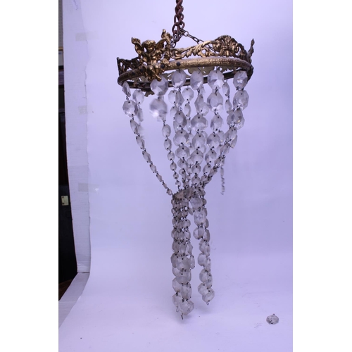 630 - A Brass mounted Bag Shaped Chandelier. Measuring: 26cms across.