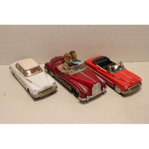 321 - A Scarce Tin Plate Car in Red Metallic with Two People along with Two Minister Cars as Found.