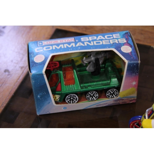 91 - A Scarce Lone Star Boxed Space Commander along with a Tin Plate Clockwork Father Christmas on a Tric... 