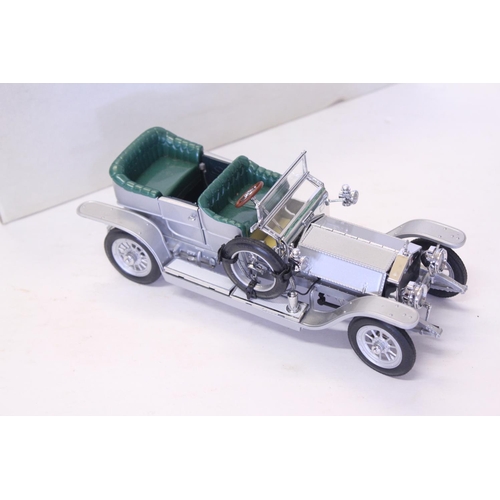 158 - A Franklin Mint 1907 Rolls Royce Silver Ghost finished in Silver. The model appears Mint & comes in ... 