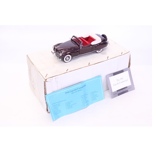 159 - A Franklin Mint 1941 Lincoln Continental finished in Dark Maroon. The model appears to be in Mint Co... 