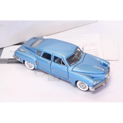 161 - A Franklin Mint 1948 Tucker finished in Light Blue Metallic. The models appears to be in Mint Condit... 