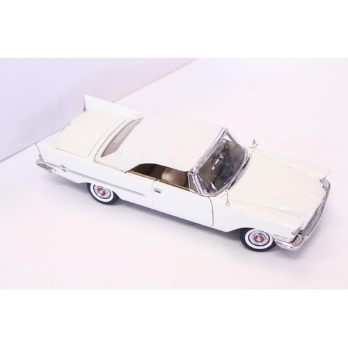 163 - A Danbury Mint 1957 Chrysler 300C Convertible finished in White. The model appears to be in Mint Con... 