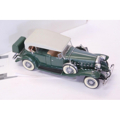 164 - A Danbury Mint 1932 Cadillac V16 Sport Phaeton finished in Green. The model appears to be Mint apart... 