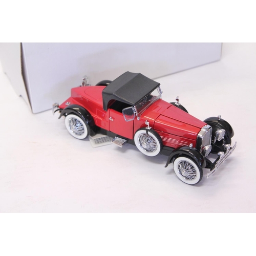 156 - A Franklin Mint 1928 Stutz Black Hawk Speedster Finished in Red & Black. The model appears to be in ... 