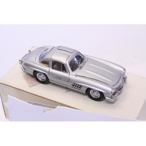 157 - A Franklin Mint Mercedes 300SL Gullwing finished in Silver along with a 1/43rd scale 1957 Chevrolet ... 