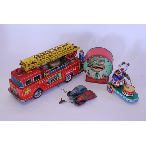 325 - A Tin Plate Friction Driven Fire Engine with Crew & in Working Order along with two Tin plate racing... 