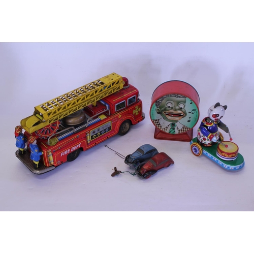 325 - A Tin Plate Friction Driven Fire Engine with Crew & in Working Order along with two Tin plate racing... 