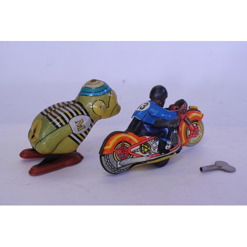 324 - A 1950s Clockwork Tin Plate Motor Cycle with Rider along with a 1950s YONE Toys of Japan Clockwork T... 