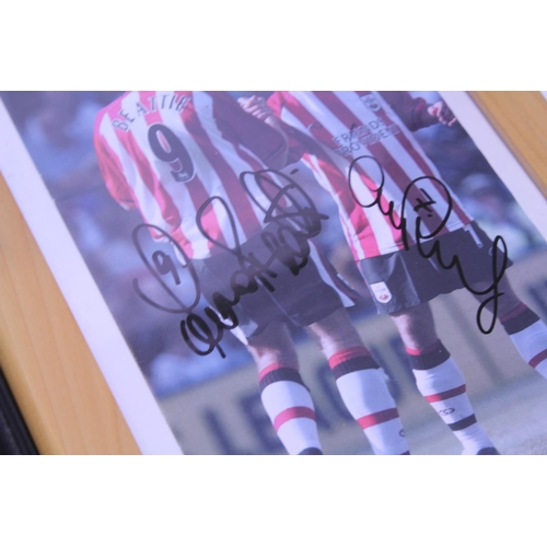 553 - A Southampton Football Club to include 2 x Framed Photos, one signed by the squad (2001-2002) along ... 