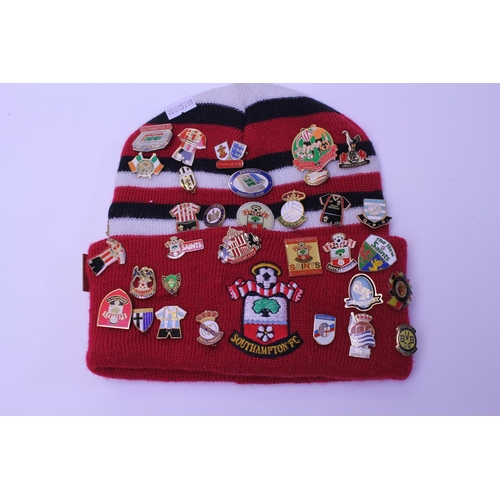 555 - A Southampton Football Club Original Woollen Hat with over 45 Original Lapel Badges from many Footba... 