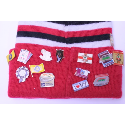 555 - A Southampton Football Club Original Woollen Hat with over 45 Original Lapel Badges from many Footba... 