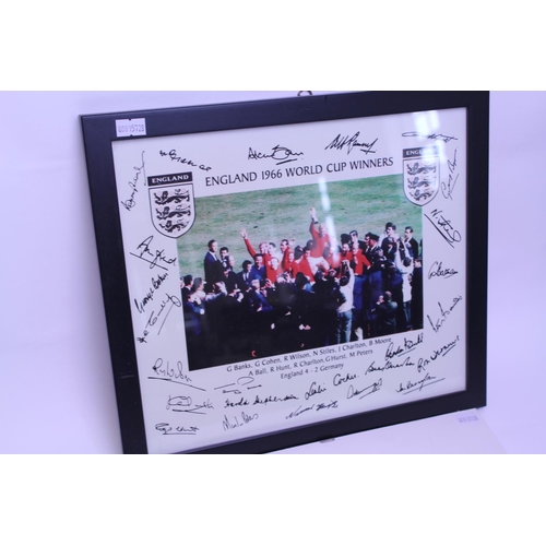 564 - A 1966 England World Cup Coloured Photograph of the Winning Team with facsimile Signatures on the bo... 