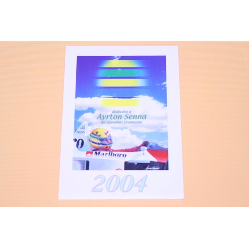 566 - An Original Ayrton Senna 2004 Race Calendar along with the Original Bottle of 