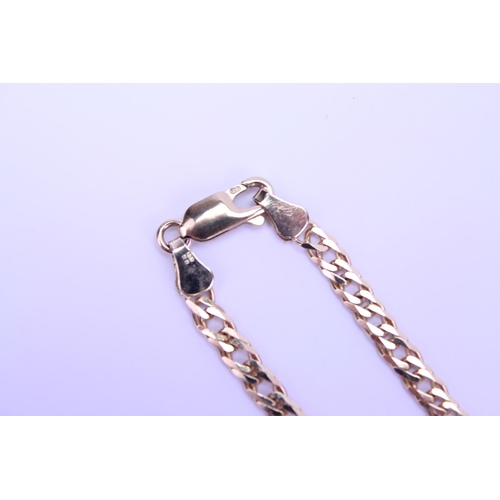 214 - A 9ct Gold Curb Link Chain. 46cms Long. Weighing: 8.6 grams.