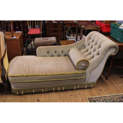 636 - A Button Backed Left Armed Chaise Lounge with scroll over arm & tassel decoration. Measuring: 170cms... 