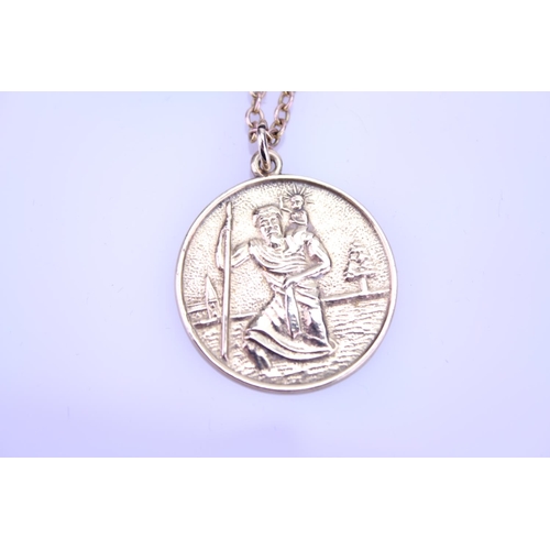 231 - A 9ct Gold St. Christopher Pendent. Weighing: 5.8 grams along with a Chain.