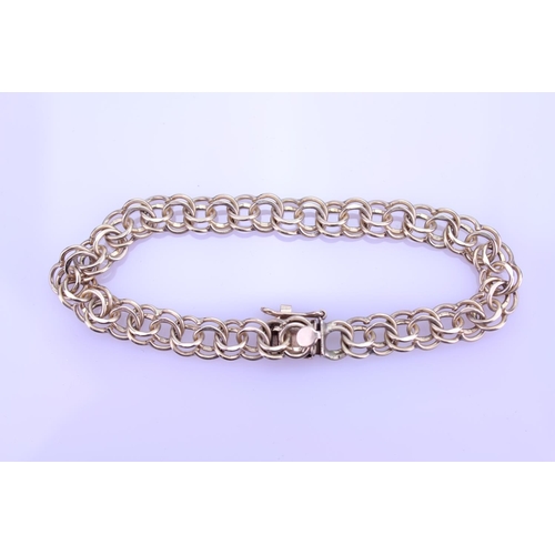 232 - A Gold Twisted Curb Link Bracelet. Weighing: 12.1 Grams.