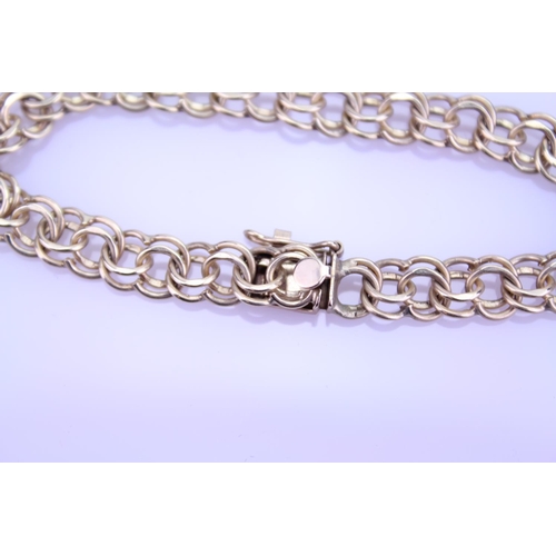 232 - A Gold Twisted Curb Link Bracelet. Weighing: 12.1 Grams.