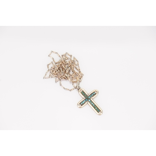 236 - A Gold coloured Turquoise Cross pendant hung on a gold coloured chain.