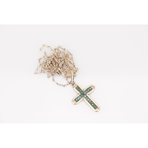 236 - A Gold coloured Turquoise Cross pendant hung on a gold coloured chain.