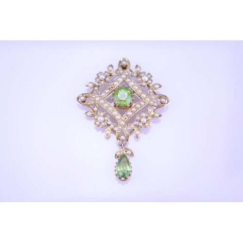 237 - A Beautiful 15ct Gold peridot and pearl brooch with teardrop peridot, fitted with pendant fitting, d... 