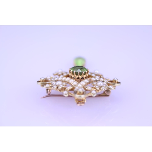 237 - A Beautiful 15ct Gold peridot and pearl brooch with teardrop peridot, fitted with pendant fitting, d... 