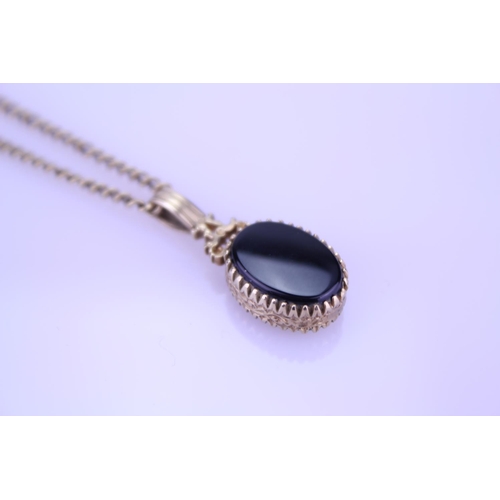 256 - A 9ct Gold blood stone/onyx fob pendant on chain. Weight approximately 9.5g.