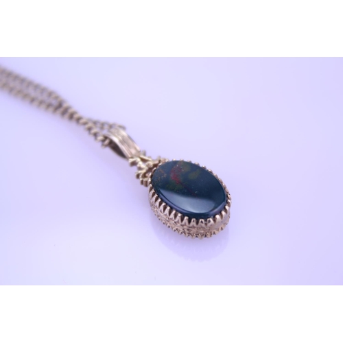 256 - A 9ct Gold blood stone/onyx fob pendant on chain. Weight approximately 9.5g.