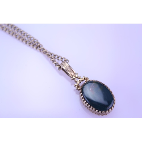 256 - A 9ct Gold blood stone/onyx fob pendant on chain. Weight approximately 9.5g.