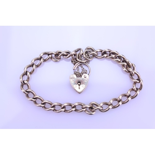 258 - A Ladies 9ct Gold curb link bracelet mounted with a heart locket, marked A S J. Weight approximately... 