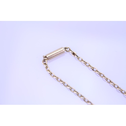 261 - A 18ct Gold child's necklace. Length approximately 22cm. Total weight approximately 3.4g.