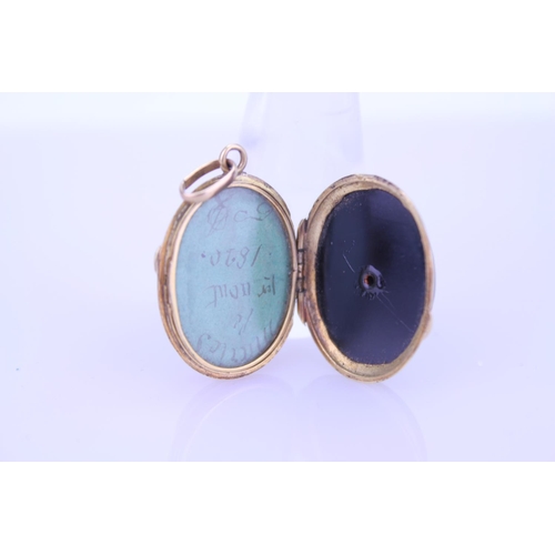 240 - A Beautiful Onyx double sided pendant 1870 inscribed on the pendant, hung on a Gold coloured chain. ... 