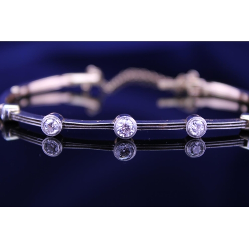 245 - A 15ct Gold Diamond bracelet converted from a watch strap, set with 5 diamonds. Largest Diamond appr... 