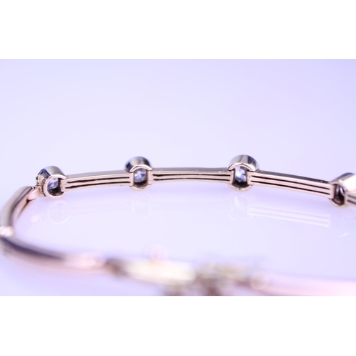 245 - A 15ct Gold Diamond bracelet converted from a watch strap, set with 5 diamonds. Largest Diamond appr... 