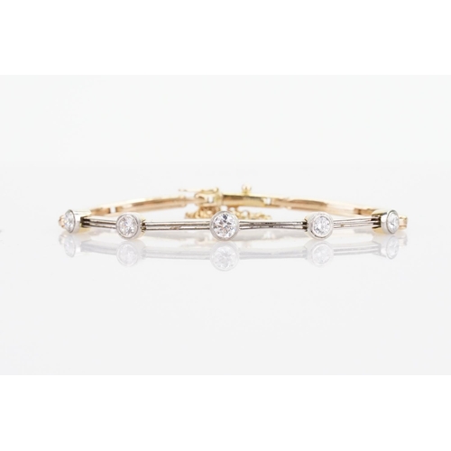 245 - A 15ct Gold Diamond bracelet converted from a watch strap, set with 5 diamonds. Largest Diamond appr... 