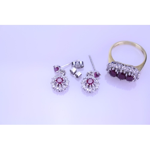 247 - An 18ct Gold Ruby and Diamond set Ring along with a similar pair of Ruby and Diamond earrings. Total... 