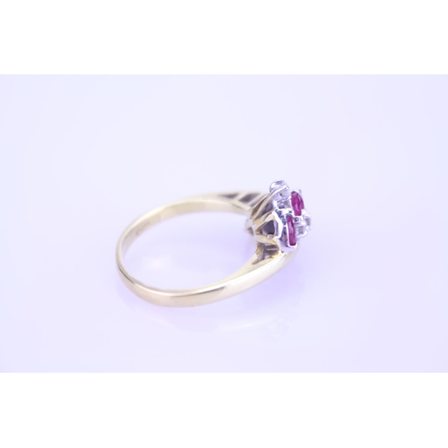 248 - An 18ct Gold Diamond and Ruby set Ring. Size approx: N. Weight approximately 5.4 grams.