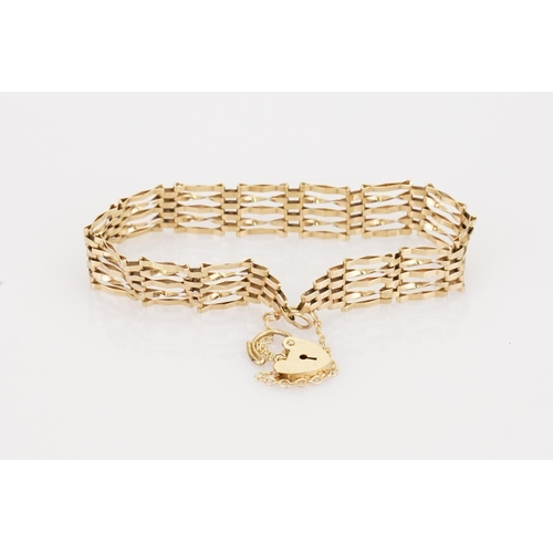 217 - A 9ct Gold Gate Bracelet fitted with a 9ct Gold heart padlock. Total weight approximately: 5.6 grams... 