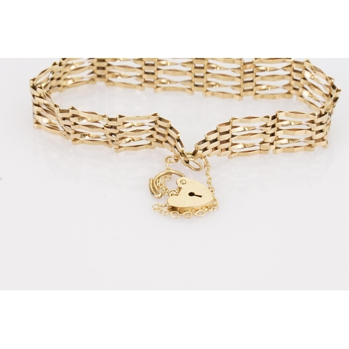 217 - A 9ct Gold Gate Bracelet fitted with a 9ct Gold heart padlock. Total weight approximately: 5.6 grams... 