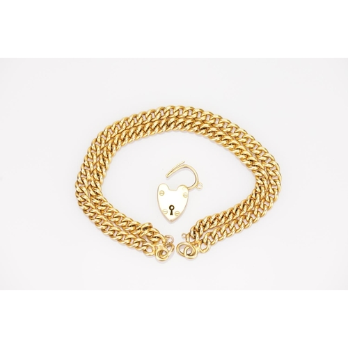 218 - A 9ct Gold double chain bracelet, each link marked 9ct, with a 9ct Gold padlock. Total weight approx... 