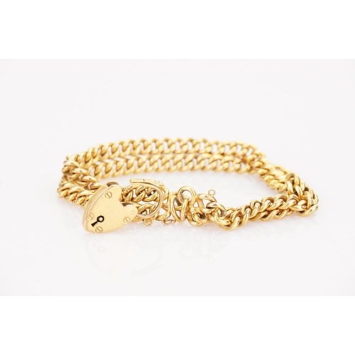 218 - A 9ct Gold double chain bracelet, each link marked 9ct, with a 9ct Gold padlock. Total weight approx... 