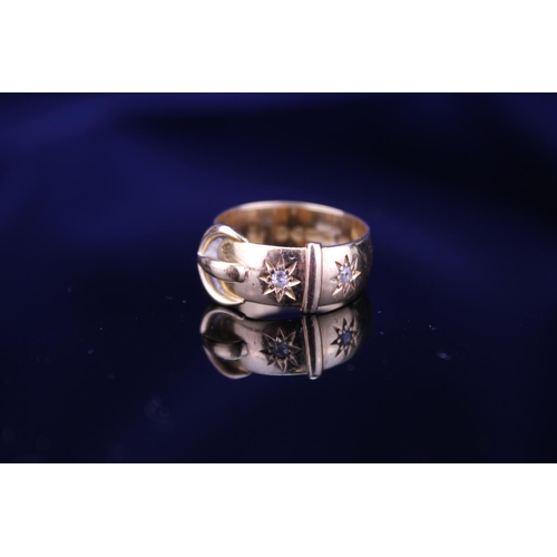 220 - An 18ct Gold Buckle Ring set with two small Diamonds. Total weight approximately: 5.9grams. Size app... 