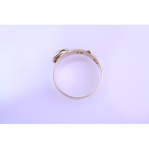 220 - An 18ct Gold Buckle Ring set with two small Diamonds. Total weight approximately: 5.9grams. Size app... 