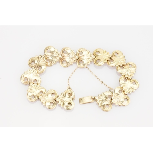 221 - A 9ct Gold Bracelet in the Gesso design with safety chain. Weight approximately: 18.3 grams.