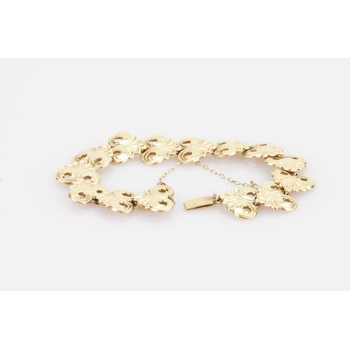 221 - A 9ct Gold Bracelet in the Gesso design with safety chain. Weight approximately: 18.3 grams.