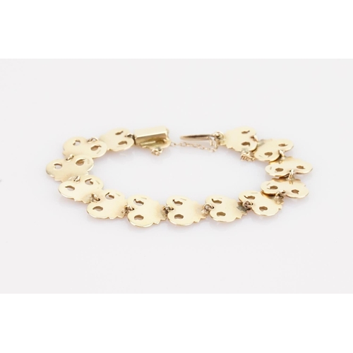 221 - A 9ct Gold Bracelet in the Gesso design with safety chain. Weight approximately: 18.3 grams.