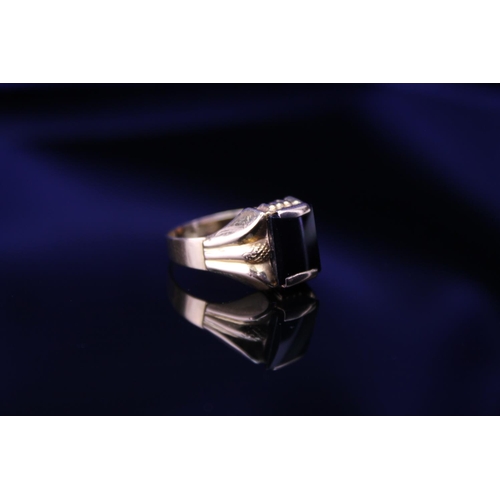 225 - A Gentleman's 750 marked Signet Ring mounted with a rectangular Onyx. Onyx size: approximately 1cm x... 