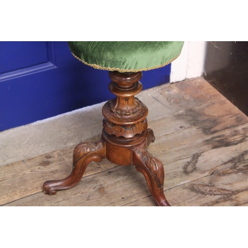 622 - A Victorian Walnut Framed Rise Top Piano Stool with Floral & Gadrooned decoration.